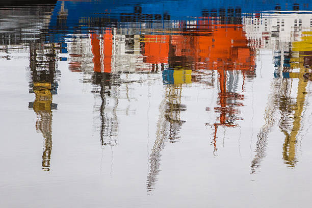 Reflections in a harbor stock photo