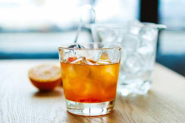 Refreshing strong alocoholic drink on table in bar.Strong cocktail with bourbon whiskey and oranges slice Orange whisky with ice in glass. screwdriver drink stock pictures, royalty-free photos & images