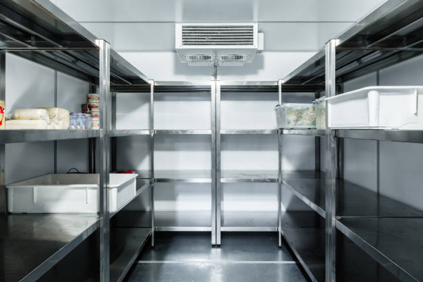 Refrigerator chamber with steel shelves in a restaurant stock photo