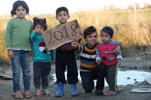 2018 refugee camp syria - kids showing paper stock photo