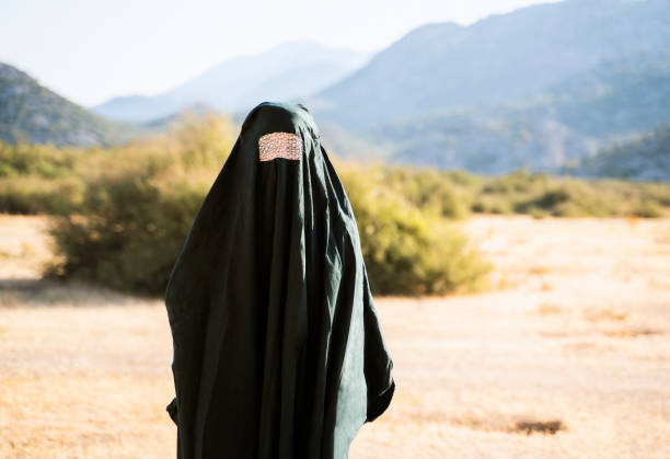 Refugee woman in burka outdoor portrait stock photo