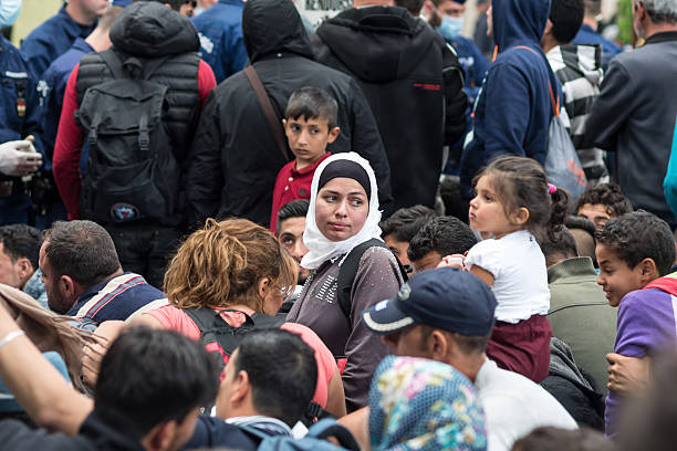 Refugees in the Keleti train station structure of Budapest city stock photo