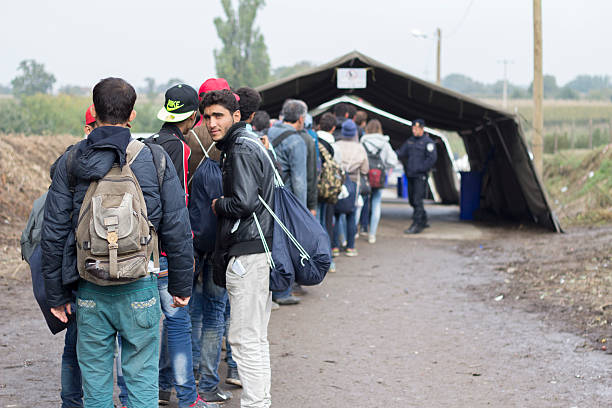 refugees waiting to cross the serbo-croatian border - migrants stok fotoğraflar ve resimler