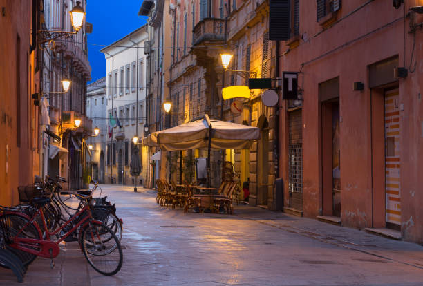 Reggio Emilia - The street of the old town at dusk. stock photo