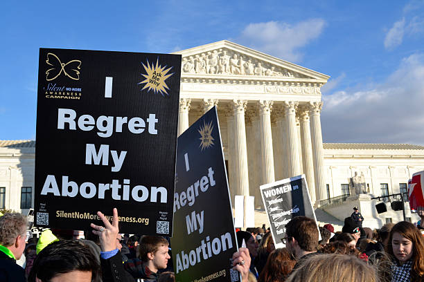 I Regret My Abortion Washington, D.C. - USA, January 22, 2015; Women hold "I Regret My Abortion" signs at the U.S. Supreme Court in Washington D.C. on the annual March For Life Rally. abortion protest stock pictures, royalty-free photos & images