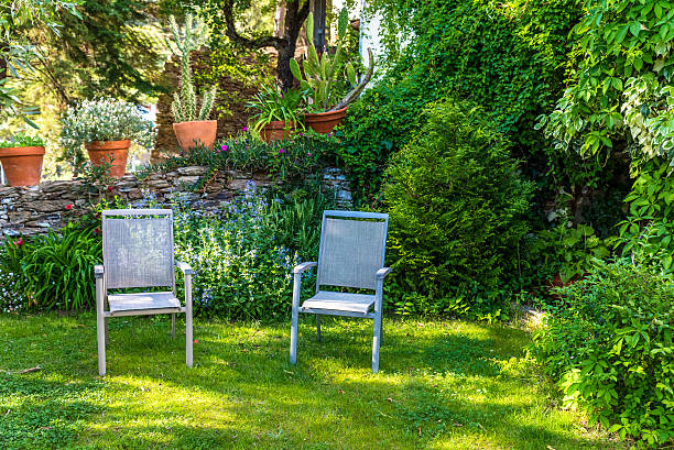 Relaxing In Beautiful Garden With Chairs Stock Photo Download