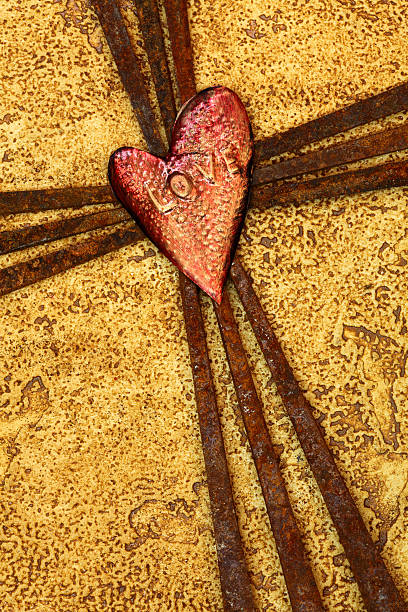 Religious: Cross of Rusty Nails with Heart says love stock photo