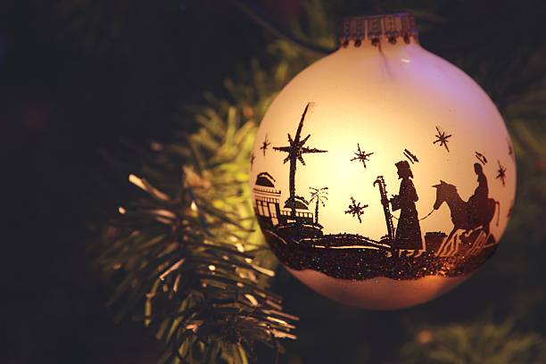 Religious: Nativity Scene silhouette on Christmas Ornament stock photo