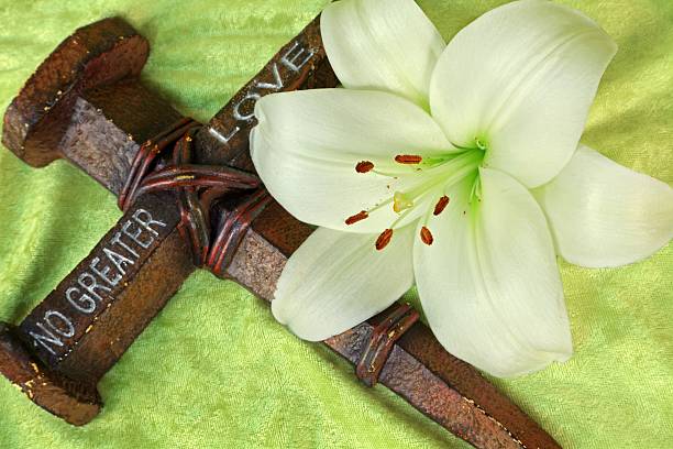 Religious: no greater Love Cross and Easter Lily stock photo
