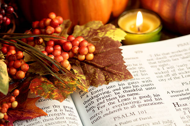 Religious: Thanksgiving Bible Scripture with fall leaves, berries, candle stock photo
