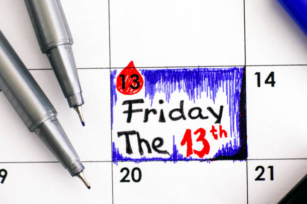 Reminder Friday The 13th in calendar with pens. Reminder Friday The 13th in calendar with pens. Close-up. friday the 13th stock pictures, royalty-free photos & images