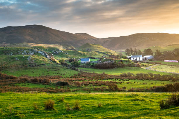 Remote Irish Valley This is a picture of a farm house in a remote valley near the sea in northern Donegal Ireland county donegal stock pictures, royalty-free photos & images