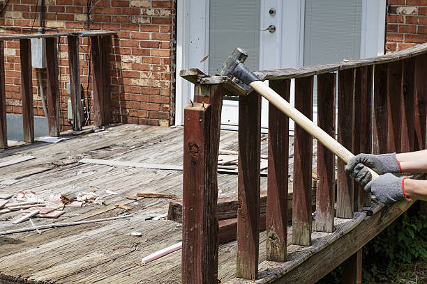 Removing an Unsafe Deck with a Sledgehammer, DIY stock photo