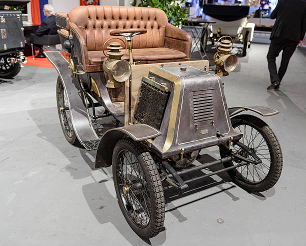 1901 Renault Type D vintage car Amsterdam, The Netherlands - April 16, 2015: 1901 Renault Type D vintage car on display during the 2015 Amsterdam motor show. People in the background are looking at the cars. 1901 stock pictures, royalty-free photos & images
