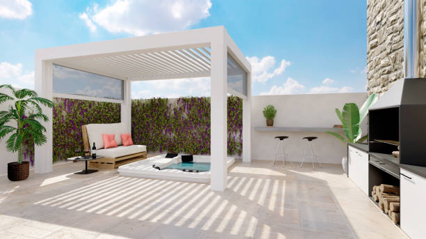 3D render of white outdoor pergola on urban patio with whirlpool and barbecue stock photo