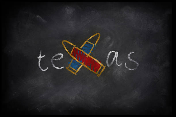 3D Rendering for Texas school shooting reigniting gun law debate. 3D Rendering of the word Texas on a blackboard with a cross made out of bullets. texas school shooting stock pictures, royalty-free photos & images