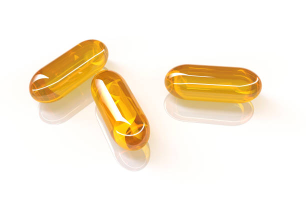 3D rendering of fish oil capsules on white background 3D photography fish oil stock pictures, royalty-free photos & images