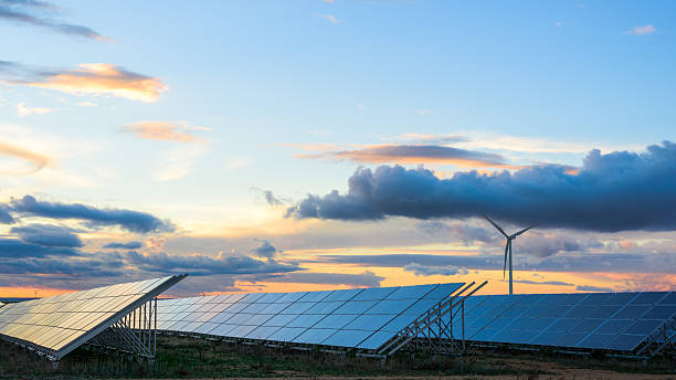renewable energies at sunset ii - wind and solar energy bildbanksfoton och bilder