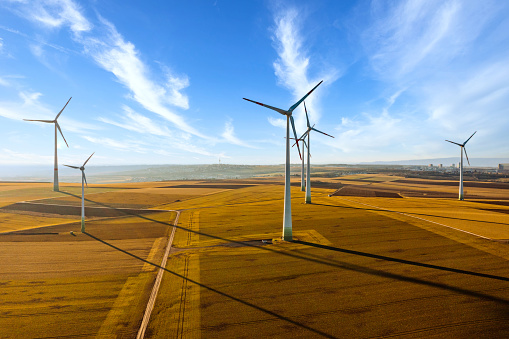 Group of windmills in a wind farm creating renewable energy