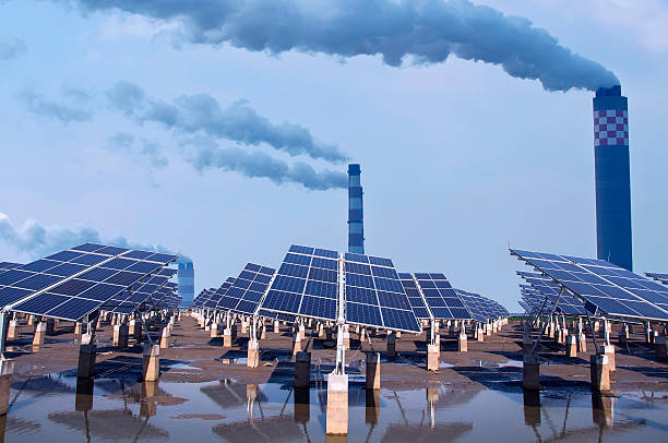 renewable solar energy and Coal-fired power plants. stock photo