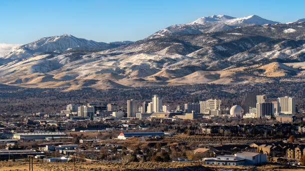 Reno cityscape the early winter with snow on the mountains in the background. stock photo