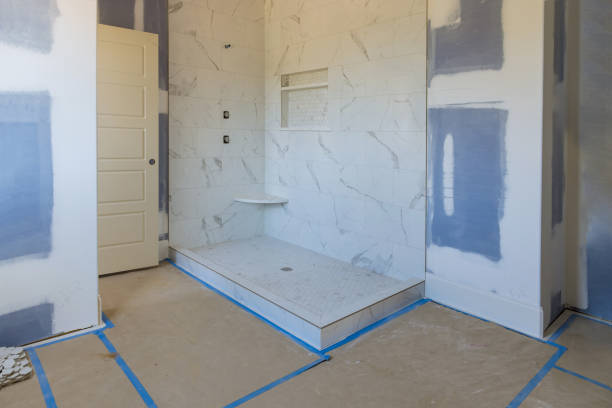 Renovation construction of master bathroom with new under construction bathroom interior drywall ready for tile stock photo