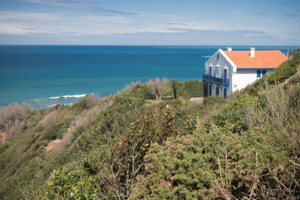 rental house on a cliff by atlantic ocean coastal footpath with scenic panoramic view stock photo