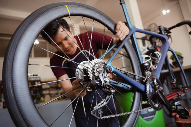 Repair technician bicycles was repaired gear bike shop. stock photo