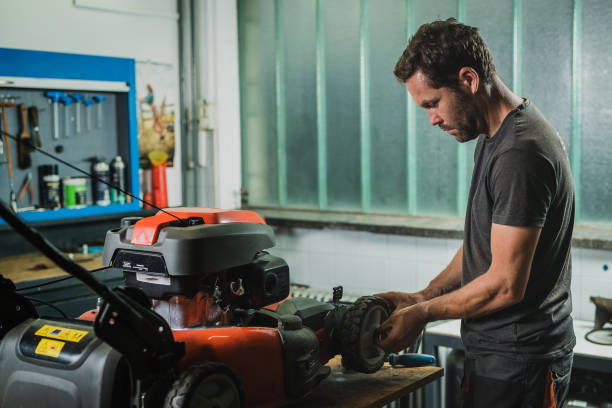 Repairing a wheel on a lawnmower stock photo