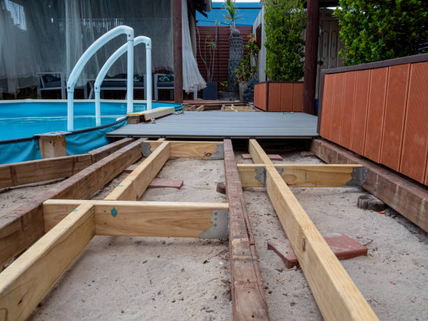 Repairing and installing new decking around a Swimming Pool. stock photo