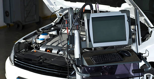 Repairing Car with computer stock photo