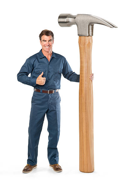 repairman-with-giant-hammer-picture-id172311074