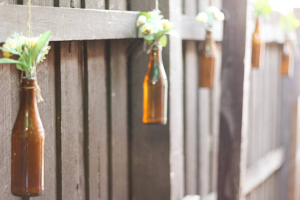 Re-purposed bottles = outdoor vases stock photo