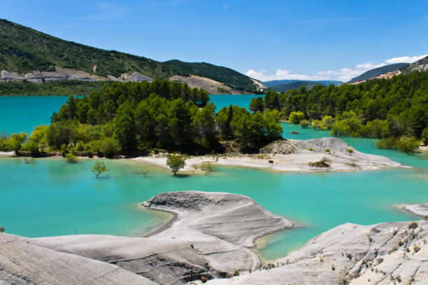 reservoir dam lake of yesa with limestone water's edge, spain stock photo