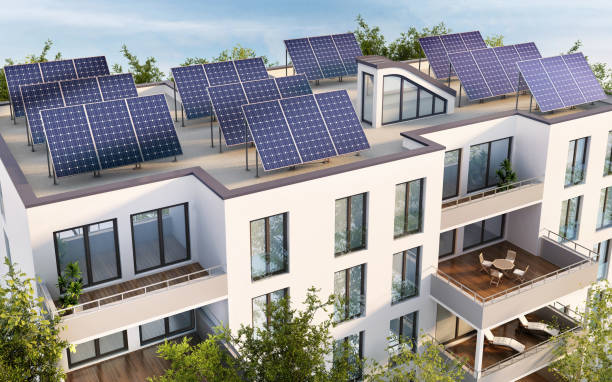 Residential building with solar panels on the roof stock photo