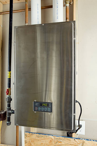 residential condensing hybrid tankless water heater - boiler stockfoto's en -beelden