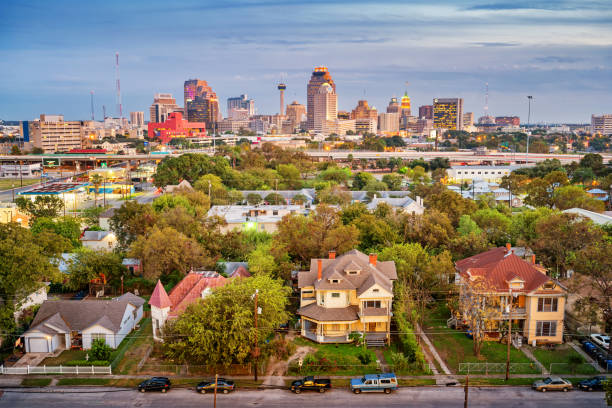Residential district and skyline of San Antonio Texas USA Stock photograph of a residential district and the downtown skyline of San Antonio Texas USA at twilight. san antonio stock pictures, royalty-free photos & images