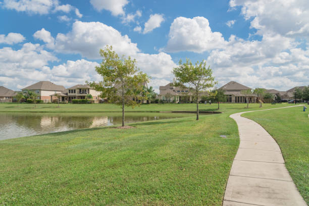 Residential houses by the lake in Pearland, Texas, USA stock photo