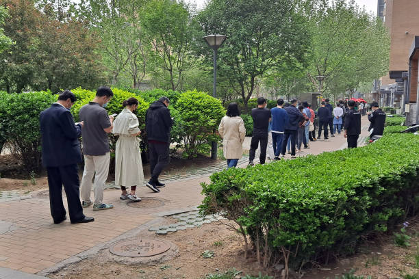 Residents queueing for covid test in local community, Beijing, China. stock photo
