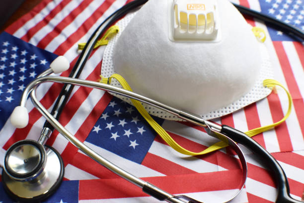N95 Respirator With Stethoscope On American Flags High Quality N95 Respirator With Stethoscope On American Flags bubonic plague photos stock pictures, royalty-free photos & images
