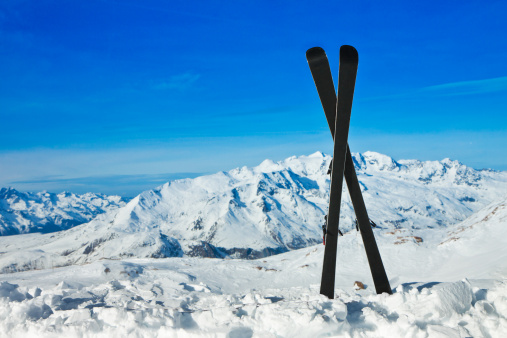 Pair of skis in snow. Winter vacations