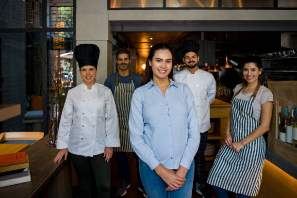 Restaurant's staff looking very happy at work stock photo