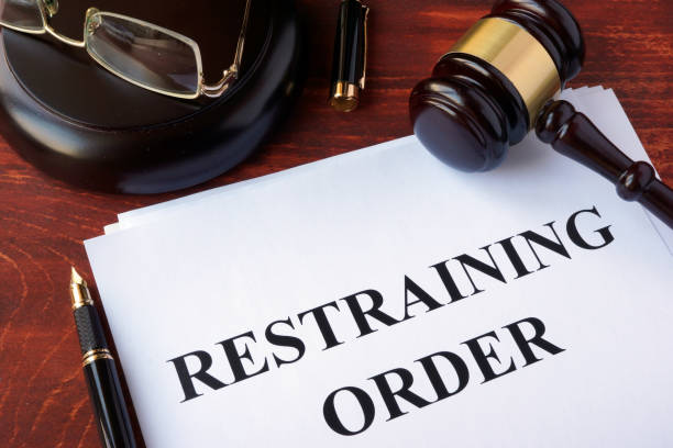 Restraining order and gavel on a table. Restraining order and gavel on a table. restraining stock pictures, royalty-free photos & images
