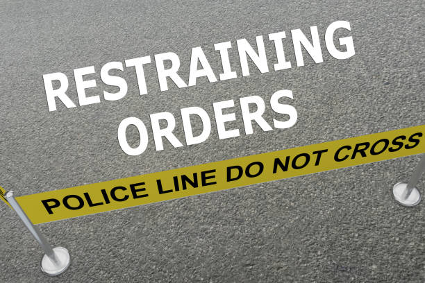 Restraining Orders concept Render illustration of Restraining Orders title on the ground in a police arena restraining stock pictures, royalty-free photos & images