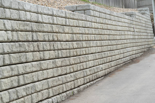 Retaining wall in residential area to protect against erosion stock photo