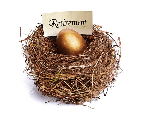 Retirement savings golden nest egg Golden nest egg concept for retirement savings nest egg stock pictures, royalty-free photos & images