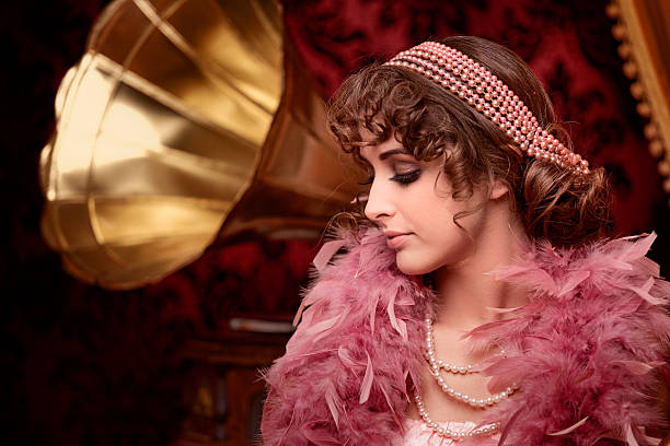 retro beuty with feather boa listening music in boudoir - beuty  stockfoto's en -beelden