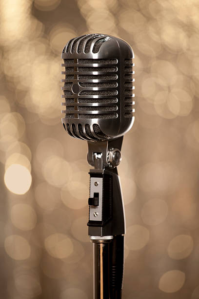 Retro chrome microphone with glamour gold background stock photo