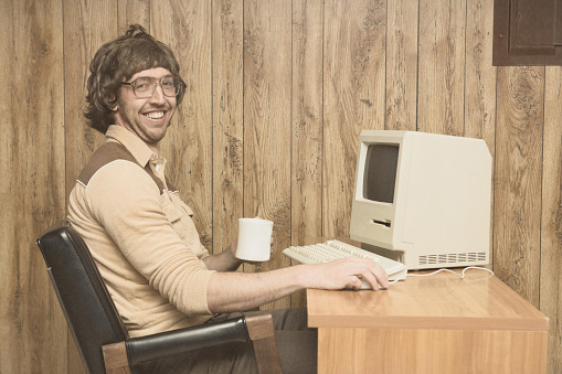 retro-computer-office-nerd-at-home-office-picture-id617888054