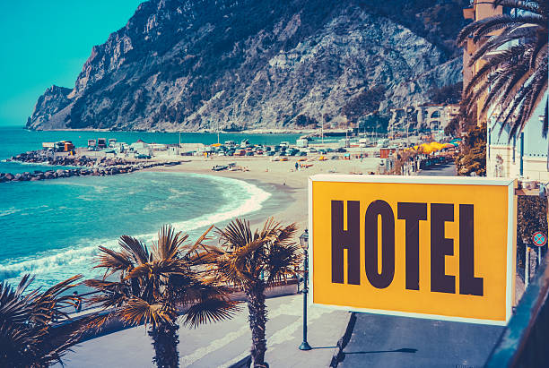 Retro Euro Beach Hotel Sign Retro Filtered Photo Of A Vintage Beach Hotel Sign hotel photos stock pictures, royalty-free photos & images